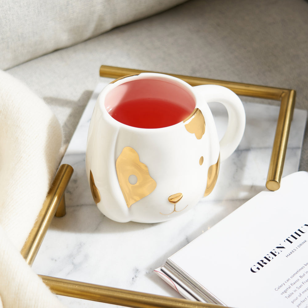 WHITE AND PINK CERAMIC WITH METALLIC SPOTS - White ceramic and metallic gold create a beautiful contrast that highlights the puppy dog design. Pink ceramic interior adds a level of warmth and coziness to every sip, no matter what you’re drinking.