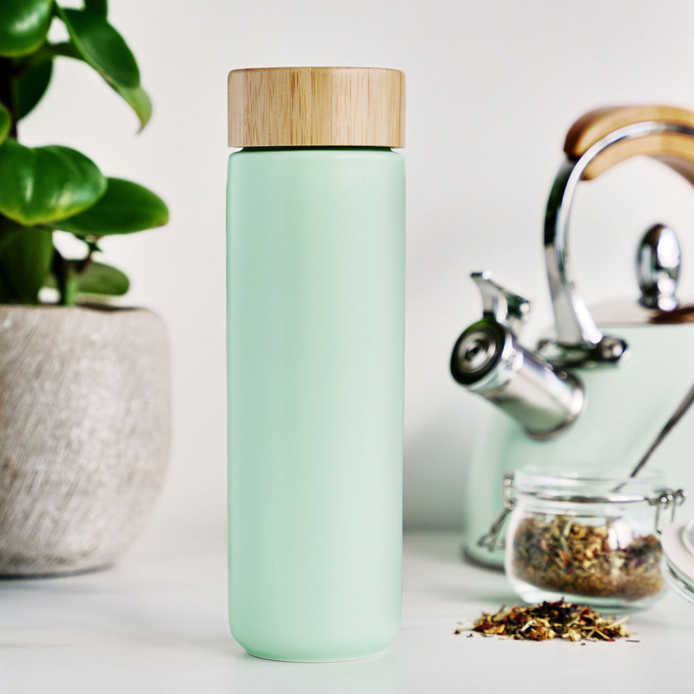 BEAUTIFUL CERAMIC MUG WITH TEA INFUSER - The slim, sleek design of the Tatyana travel tea cup with infuser and lid makes it comfortable to hold and keeps your favorite tea piping hot. The stainless steel infuser cup is easy to use and easy to clean.