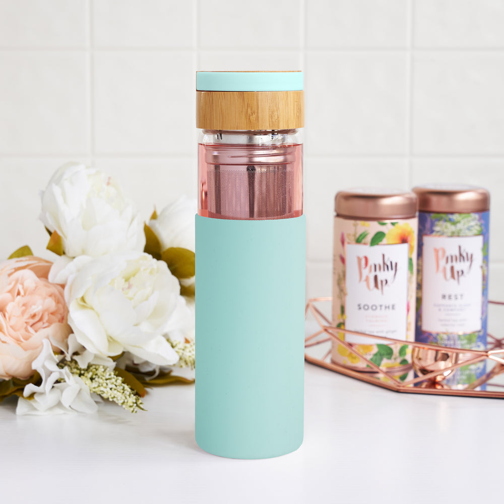 SINGLE-WALLED INSULATED GLASS WITH SILICONE SLEEVE - The slim, sleek design of the Dana travel infuser mug keeps your tea hot while the exterior silicone sleeve stays cool.