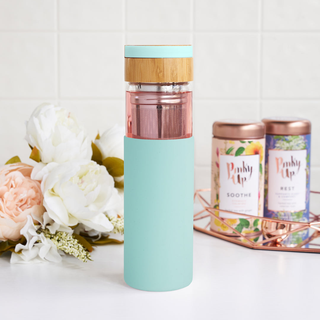 SINGLE-WALLED INSULATED GLASS WITH SILICONE SLEEVE - The slim, sleek design of the Dana travel infuser mug keeps your tea hot while the exterior silicone sleeve stays cool.