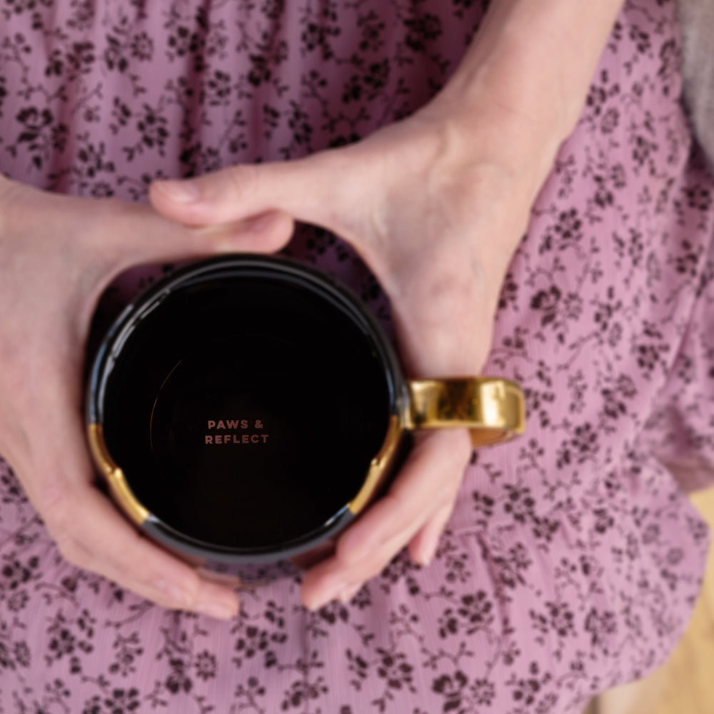 BLACK KITTY MUG WITH METALLIC FINISH – Fun yet stylish, this cat ceramic coffee mug is made from a shiny black ceramic with metallic gold detailing. This is a truly beautiful and charming catmug that's the perfect cat mom mug and brightens up your day.