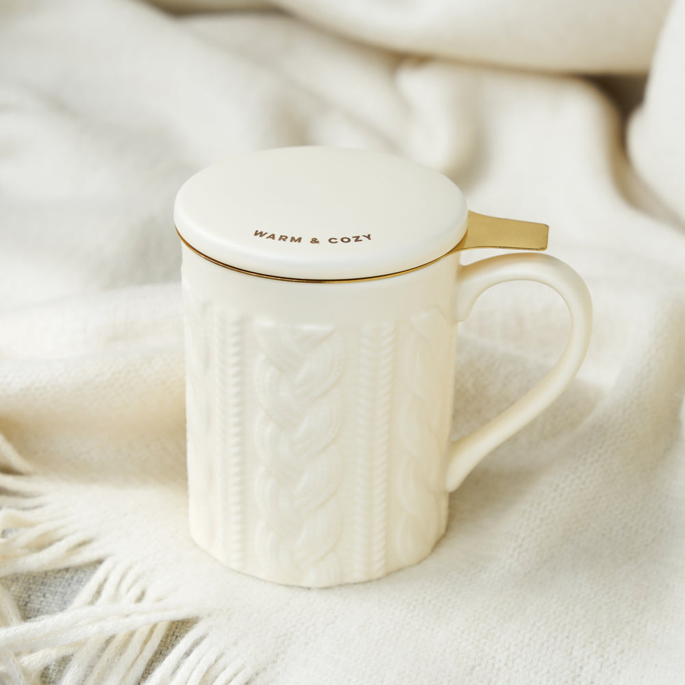 KNIT DESIGN TEA STEEPER CUP FOR TEA LOVERS - A ceramic tea cup with strainer made from stainless steel make this travel cup a useful tea drinker mug. The lid is decorated with a cute saying, and the strainer is plated with gold.