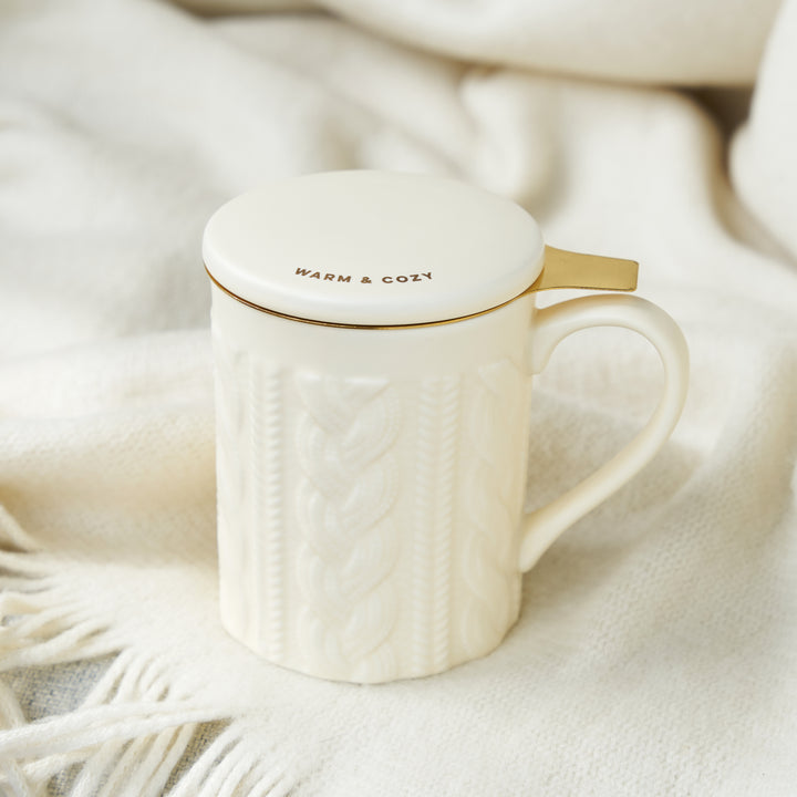 KNIT DESIGN TEA STEEPER CUP FOR TEA LOVERS - A ceramic tea cup with strainer made from stainless steel make this travel cup a useful tea drinker mug. The lid is decorated with a cute saying, and the strainer is plated with gold.